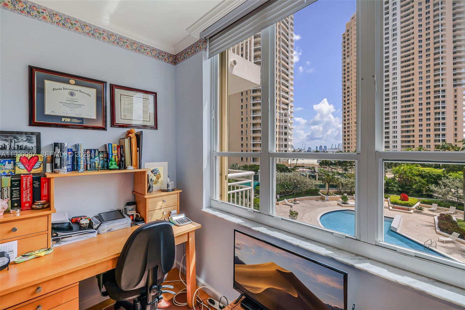 888 Brickell Key Drive, Unit 807 Miami, FL 33131 - Photo 27 of 62 a view of a workspace with furniture and a window
