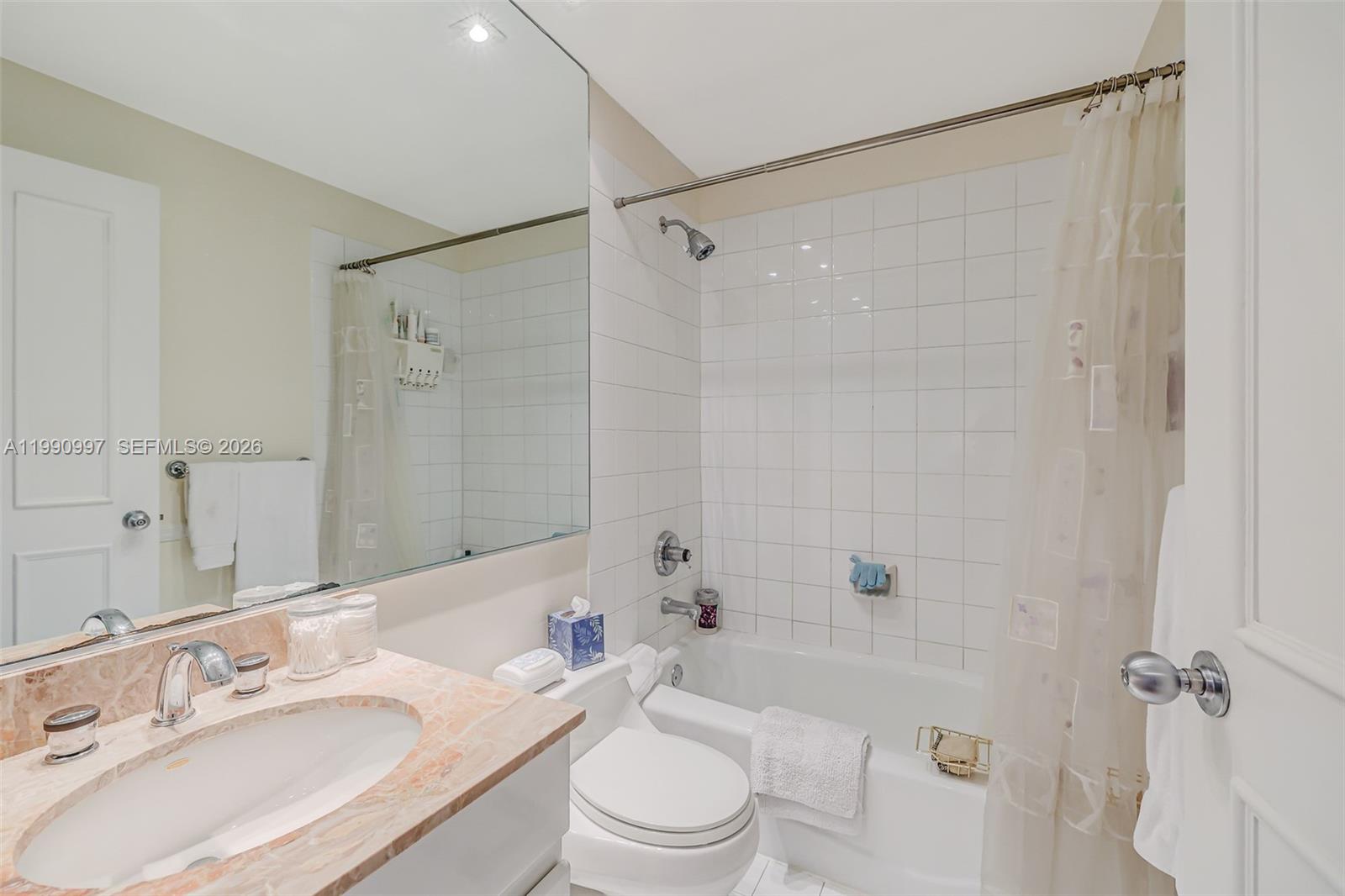 888 Brickell Key Drive, Unit 807 Miami, FL 33131 - Photo 29 of 62 a bathroom with a sink a toilet and shower