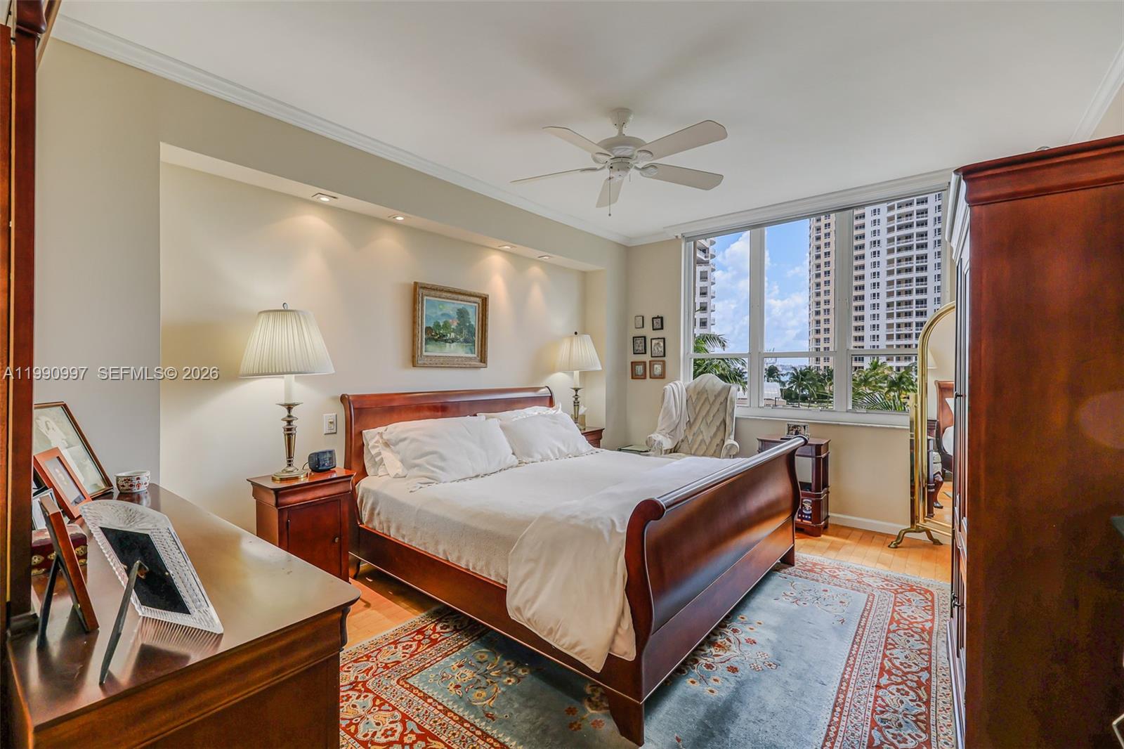 888 Brickell Key Drive, Unit 807 Miami, FL 33131 - Photo 30 of 62 a bedroom with a bed and window