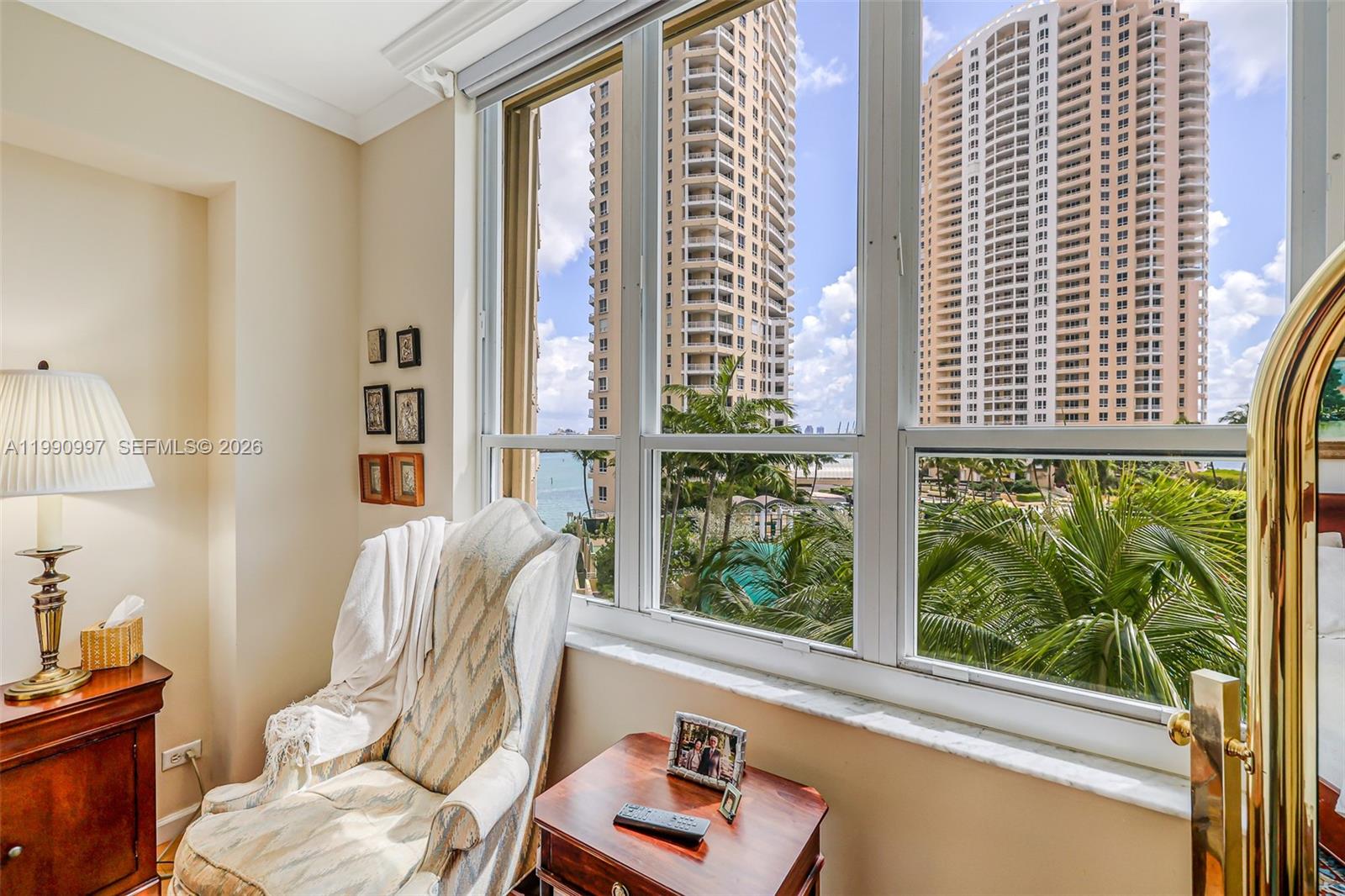 888 Brickell Key Drive, Unit 807 Miami, FL 33131 - Photo 32 of 62 a room with furniture and a window