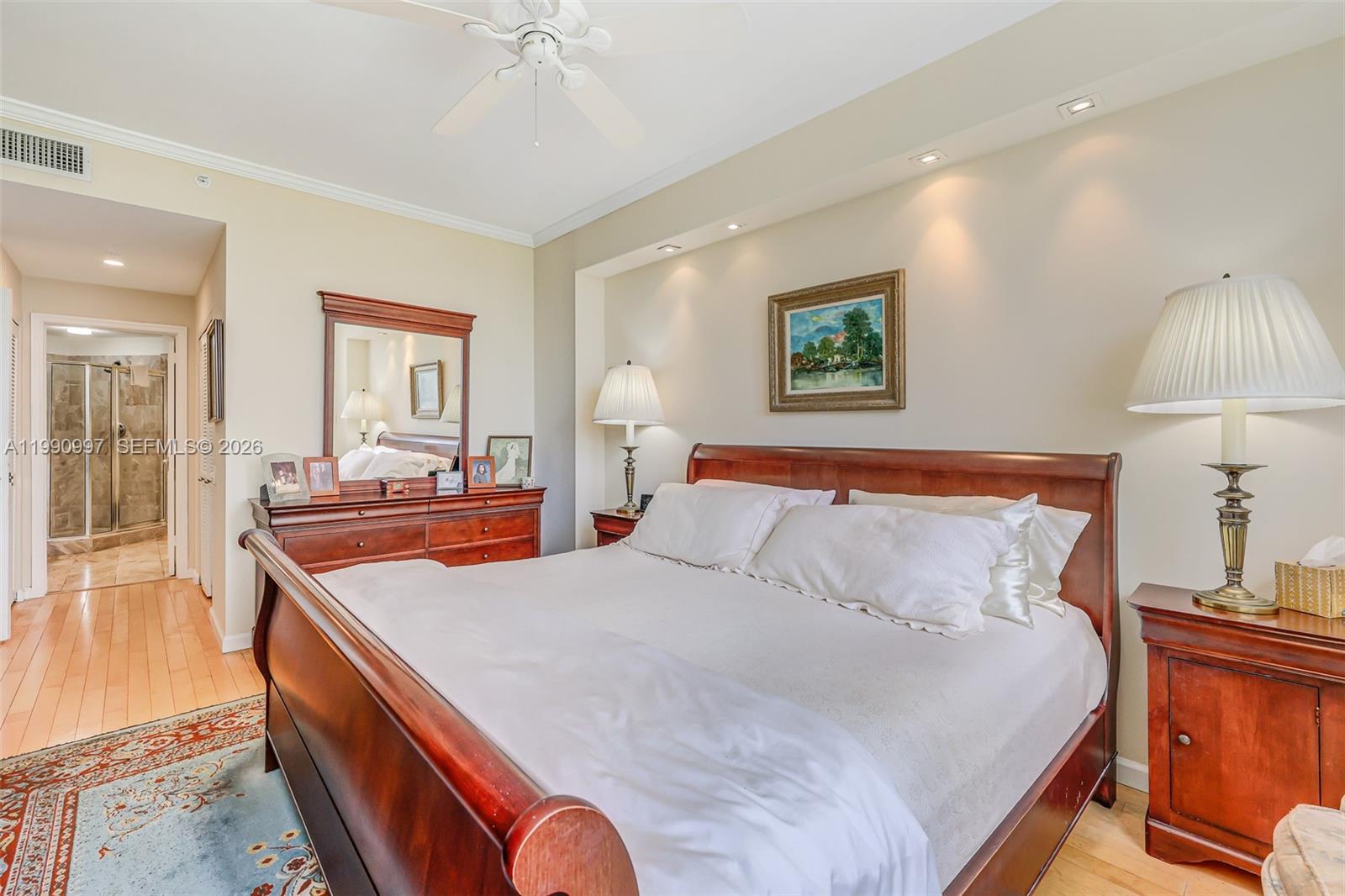 888 Brickell Key Drive, Unit 807 Miami, FL 33131 - Photo 33 of 62 a bedroom with bed and a dresser
