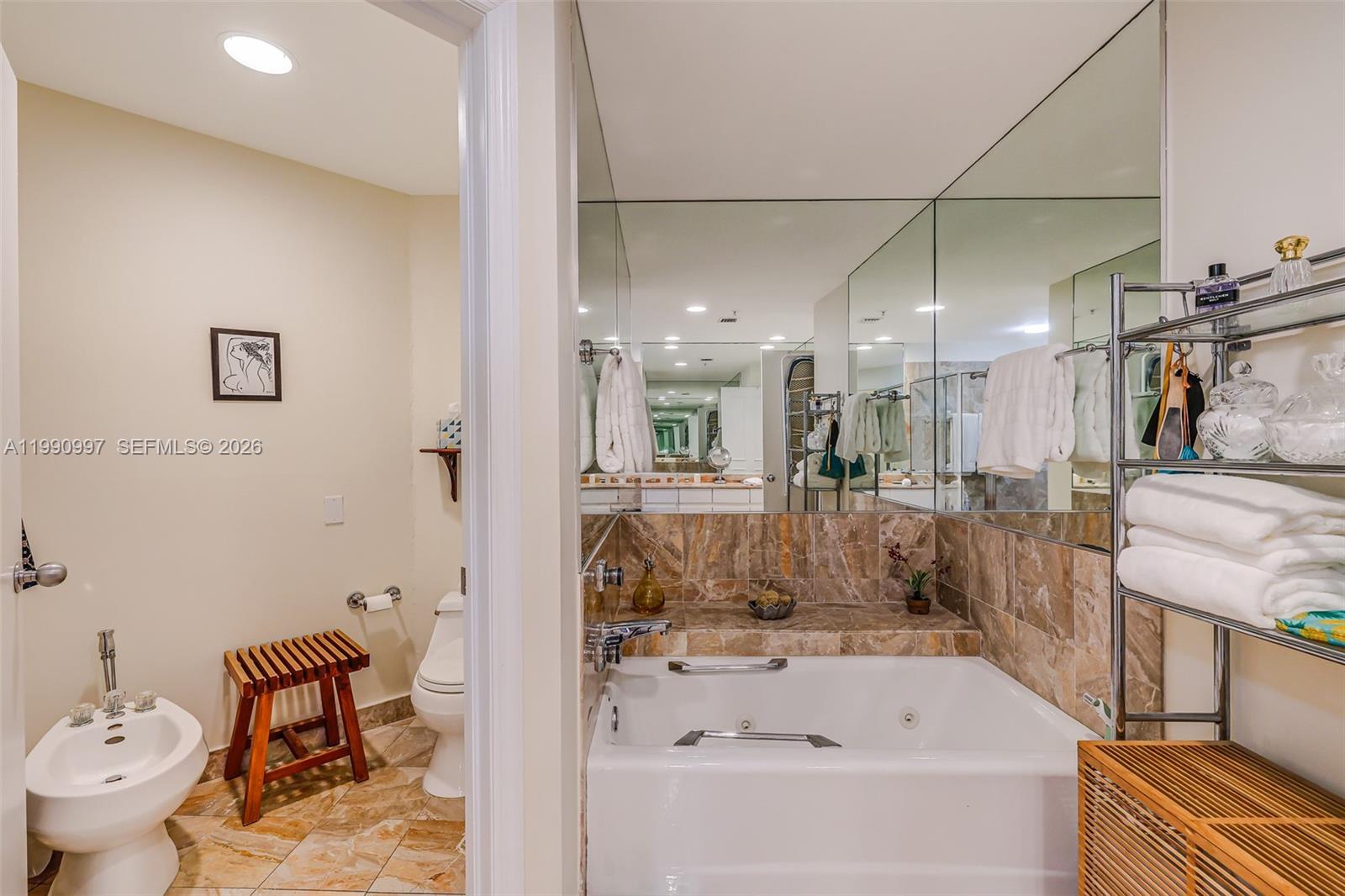 888 Brickell Key Drive, Unit 807 Miami, FL 33131 - Photo 37 of 62 a bathroom with a bathtub and shower