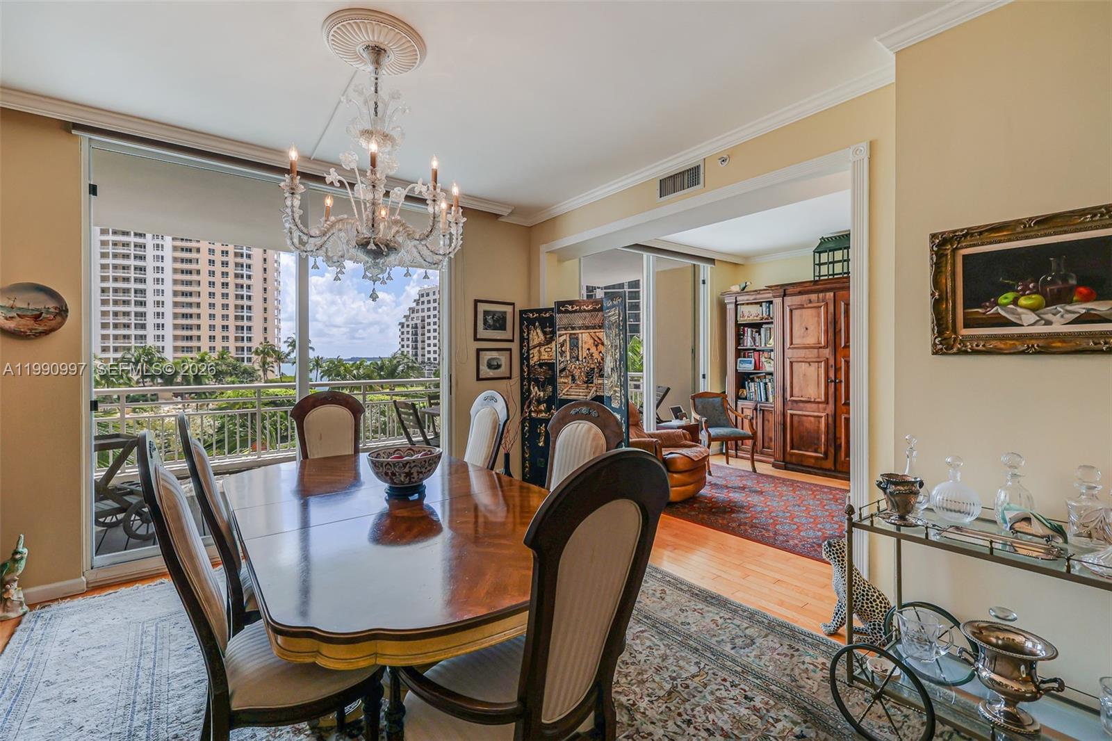 888 Brickell Key Drive, Unit 807 Miami, FL 33131 - Photo 38 of 62 a view of a dining room with furniture window and wooden floor