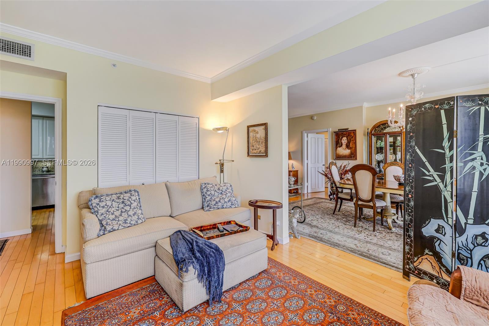 888 Brickell Key Drive, Unit 807 Miami, FL 33131 - Photo 43 of 62 a living room with furniture and wooden floor