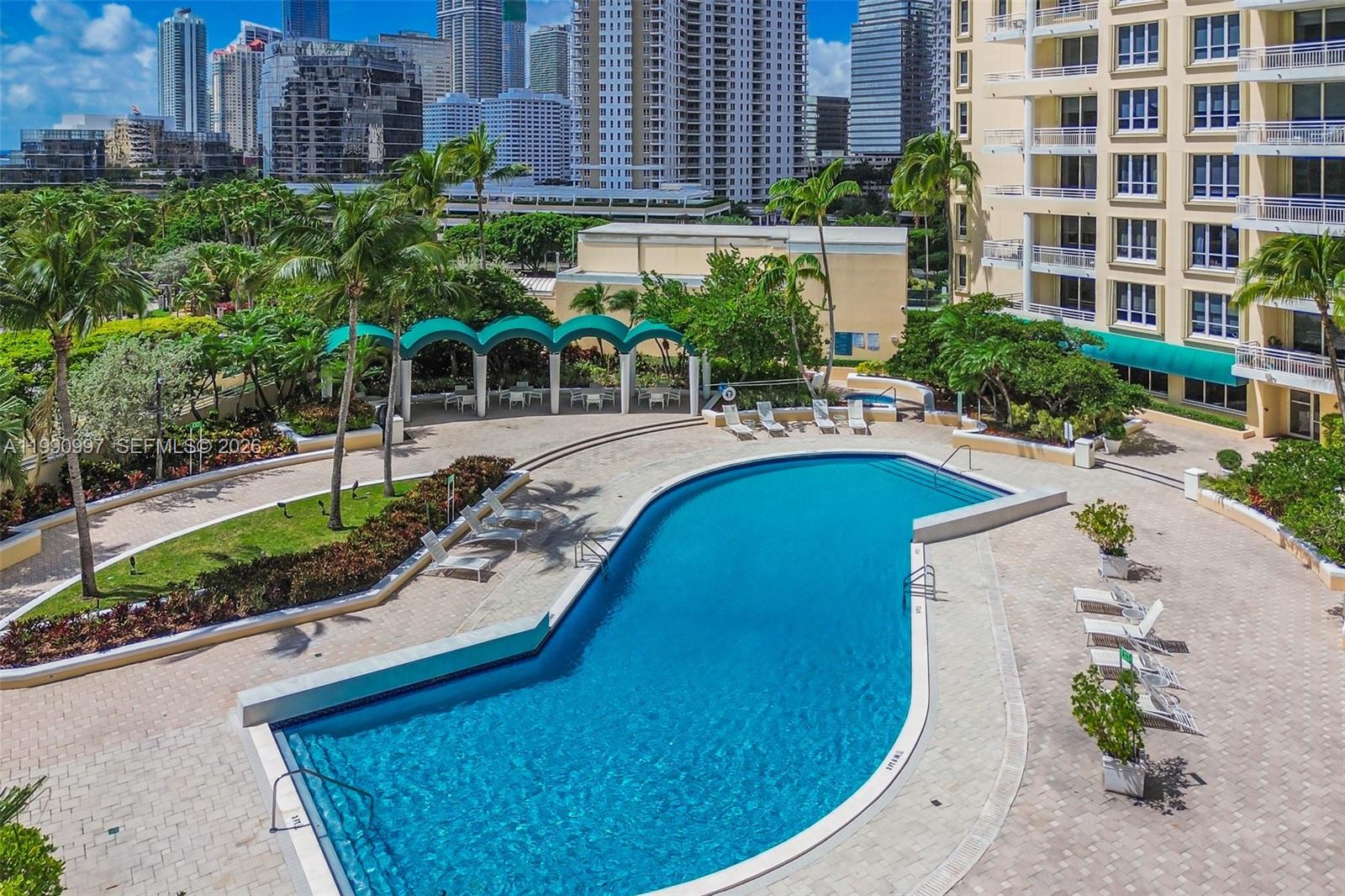 888 Brickell Key Drive, Unit 807 Miami, FL 33131 - Photo 57 of 62 a view of a swimming pool with a patio