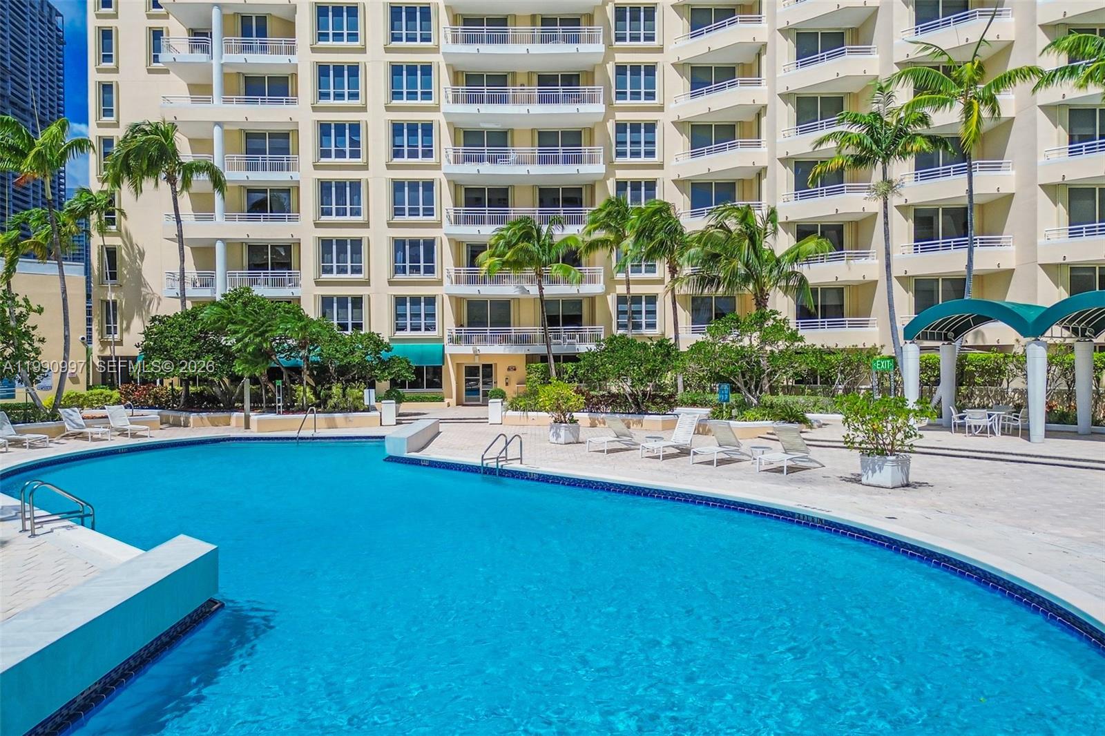 888 Brickell Key Drive, Unit 807 Miami, FL 33131 - Photo 58 of 62 a view of a house with swimming pool and sitting area