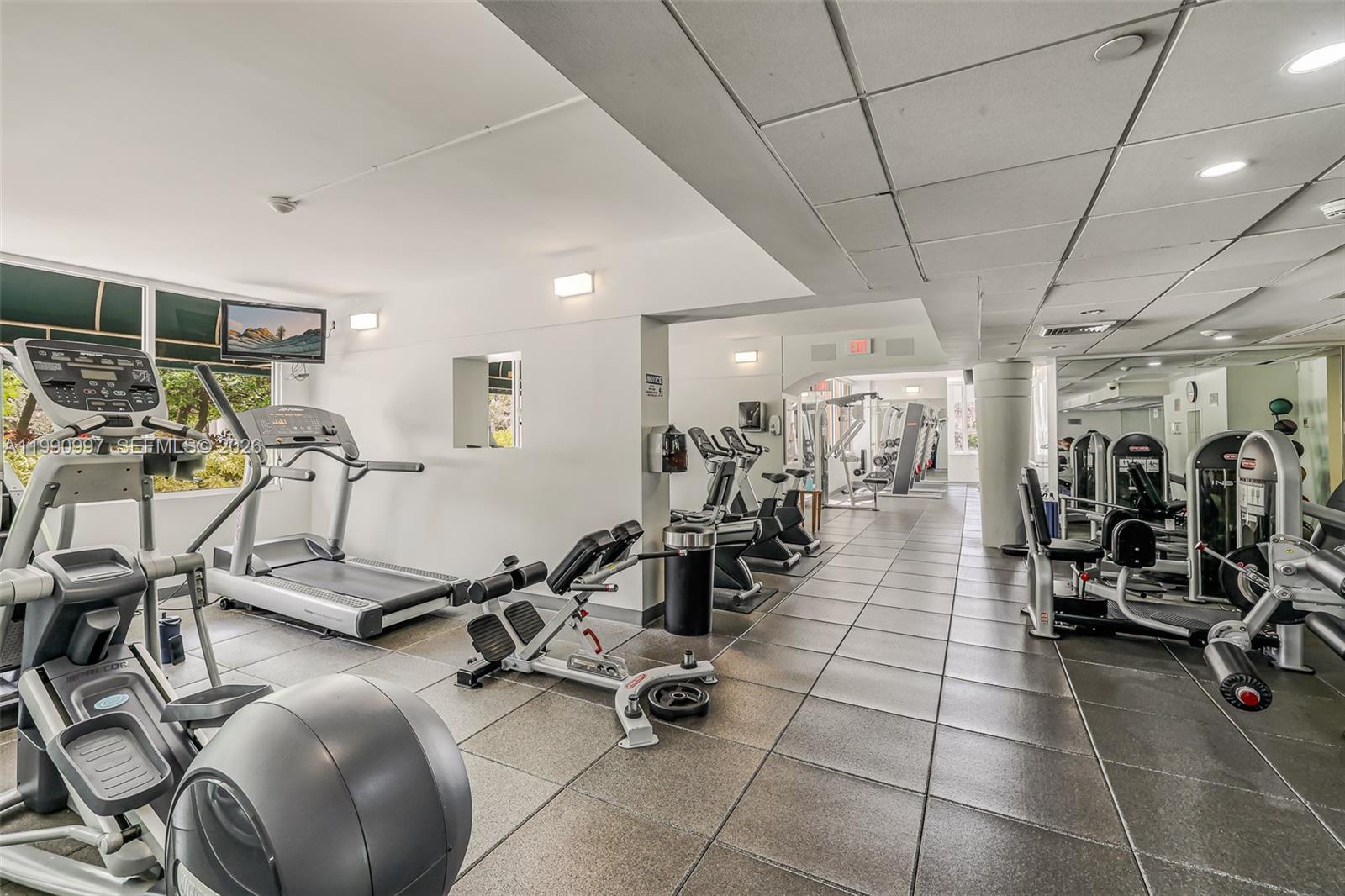 888 Brickell Key Drive, Unit 807 Miami, FL 33131 - Photo 7 of 62 a view of a room with gym equipment