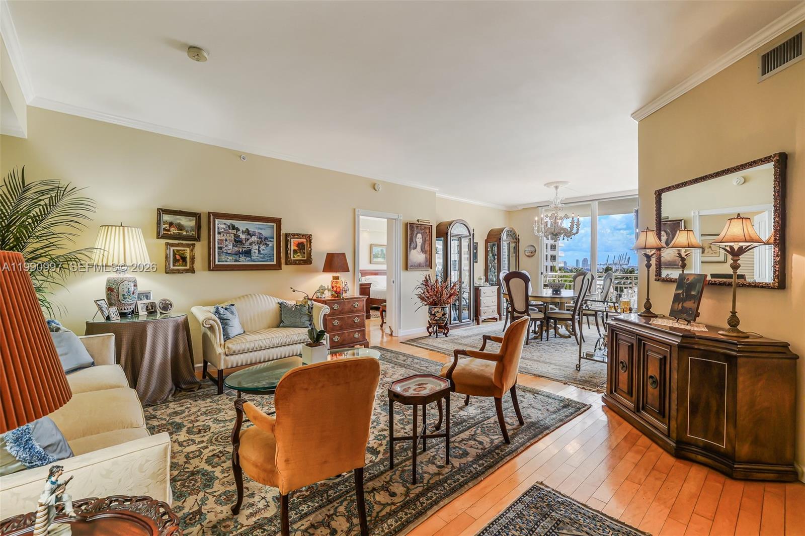 888 Brickell Key Drive, Unit 807 Miami, FL 33131 - Photo 9 of 62 a living room with lots of furniture and wooden floor