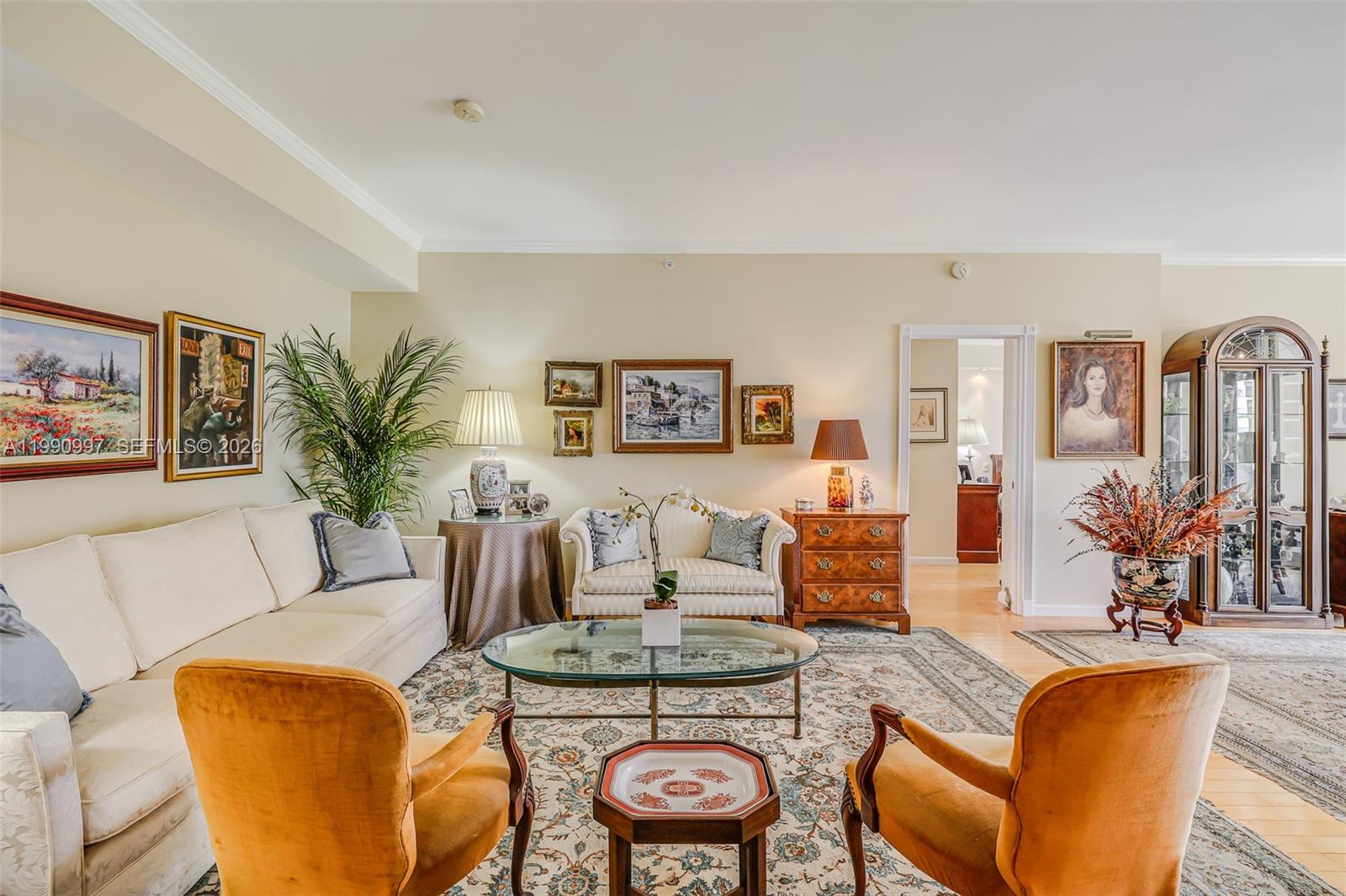 888 Brickell Key Drive, Unit 807 Miami, FL 33131 - Photo 10 of 62 a living room with furniture and wooden floor