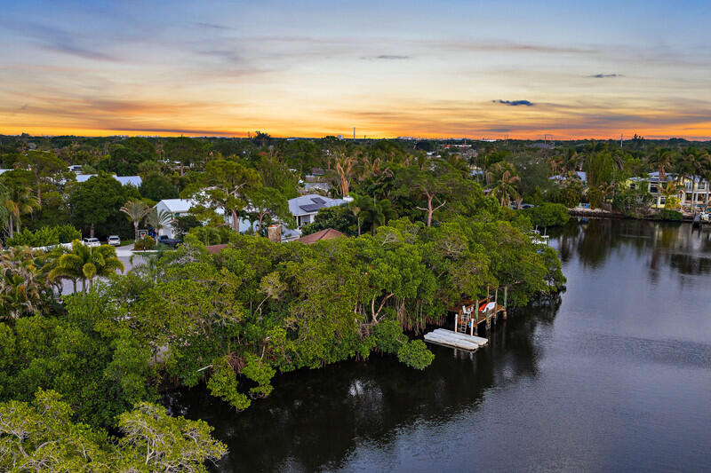 702 Warren Drive Jupiter, FL 33458 - Photo 70 of 76 a view of a lake with outdoor space