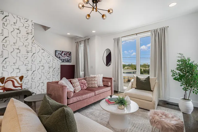 a living room with furniture and a table