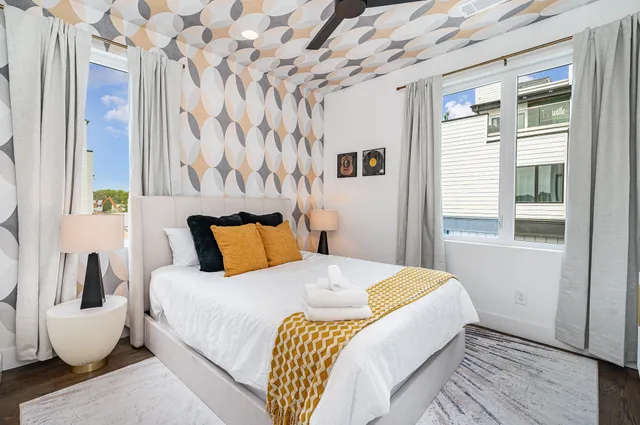 a bedroom with a bed and a window