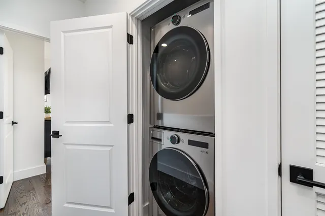 a view of a hallway with washer and dryer
