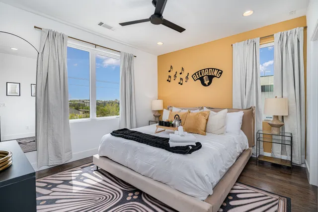 a bed room with a bed and a window