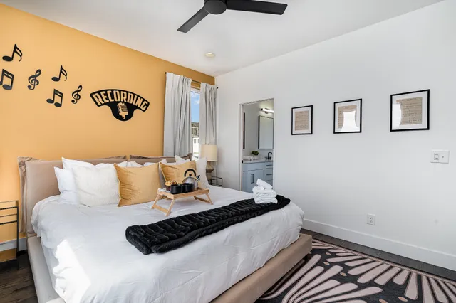 a bedroom with a bed and a window