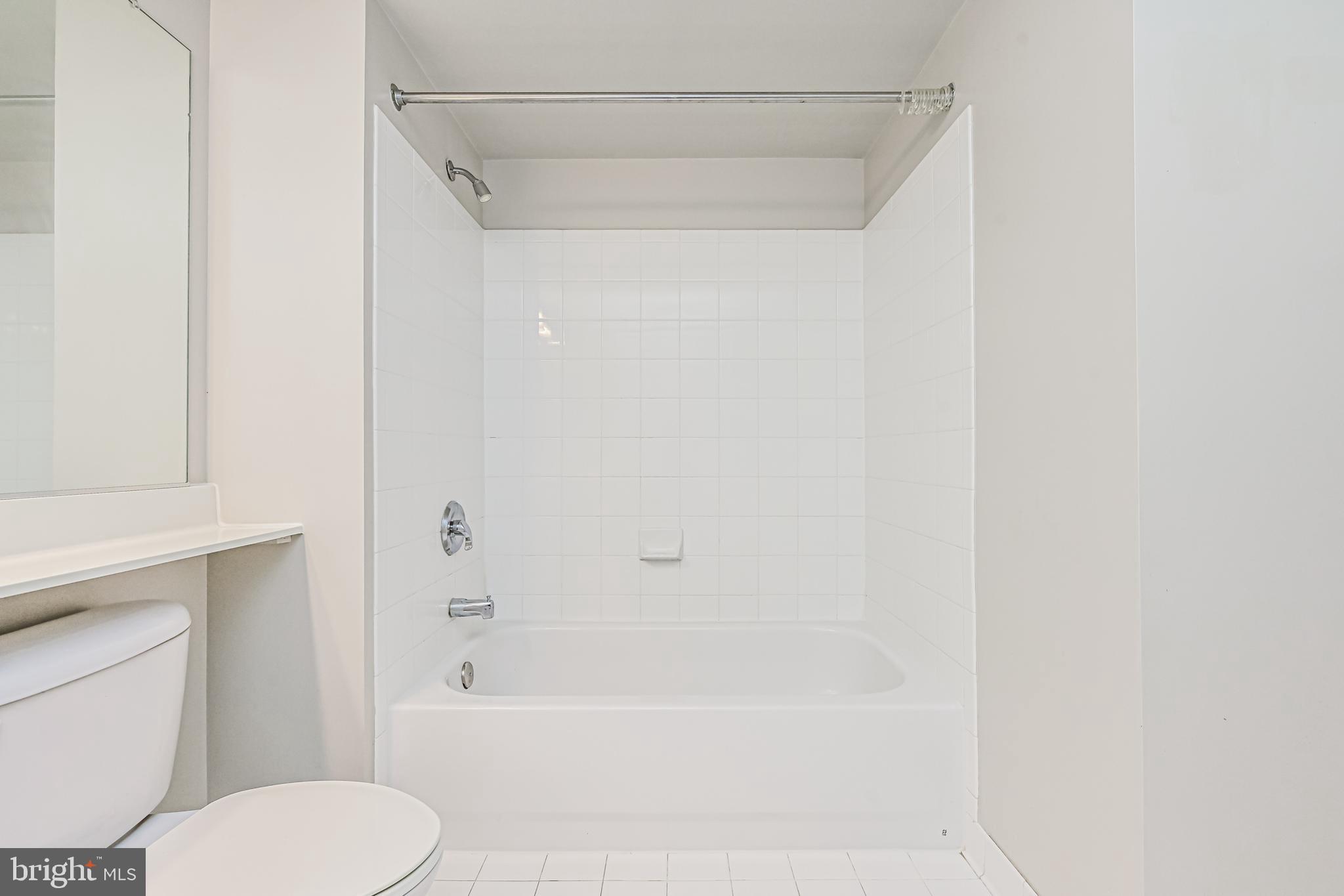 11710 Old Georgetown Road, Unit 1212 Rockville, MD 20852 - Photo 40 of 55 a bathroom with a shower and a toilet