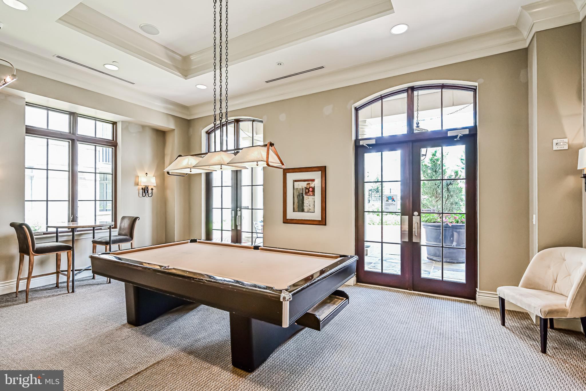 11710 Old Georgetown Road, Unit 1212 Rockville, MD 20852 - Photo 46 of 55 a living room with furniture pool table and windows