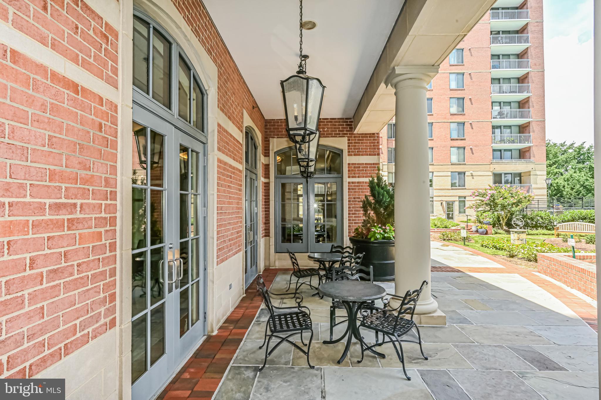 11710 Old Georgetown Road, Unit 1212 Rockville, MD 20852 - Photo 51 of 55 a view of a porch with chairs and potted plants