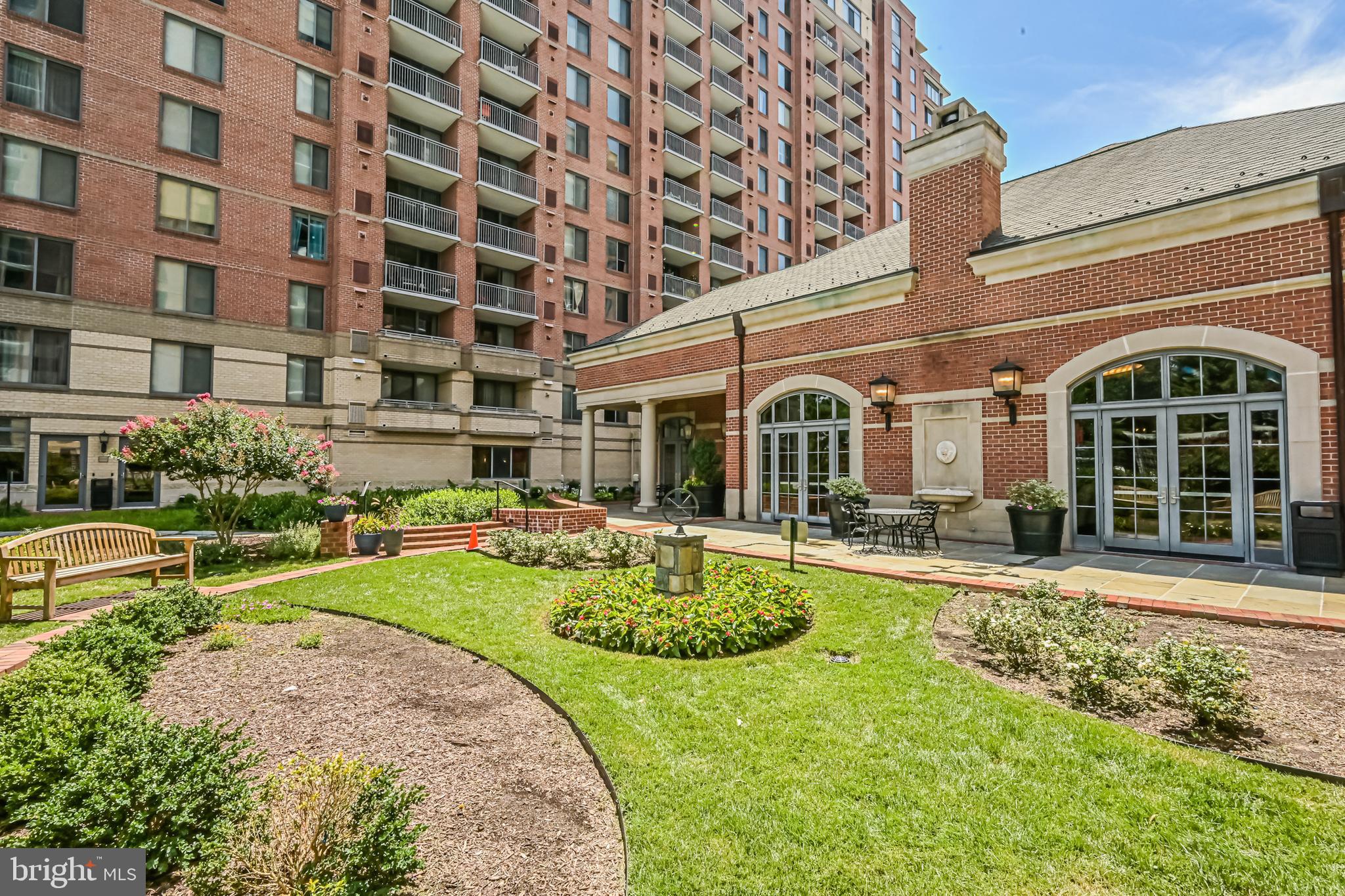 11710 Old Georgetown Road, Unit 1212 Rockville, MD 20852 - Photo 54 of 55 a view of a house with swimming pool and sitting area