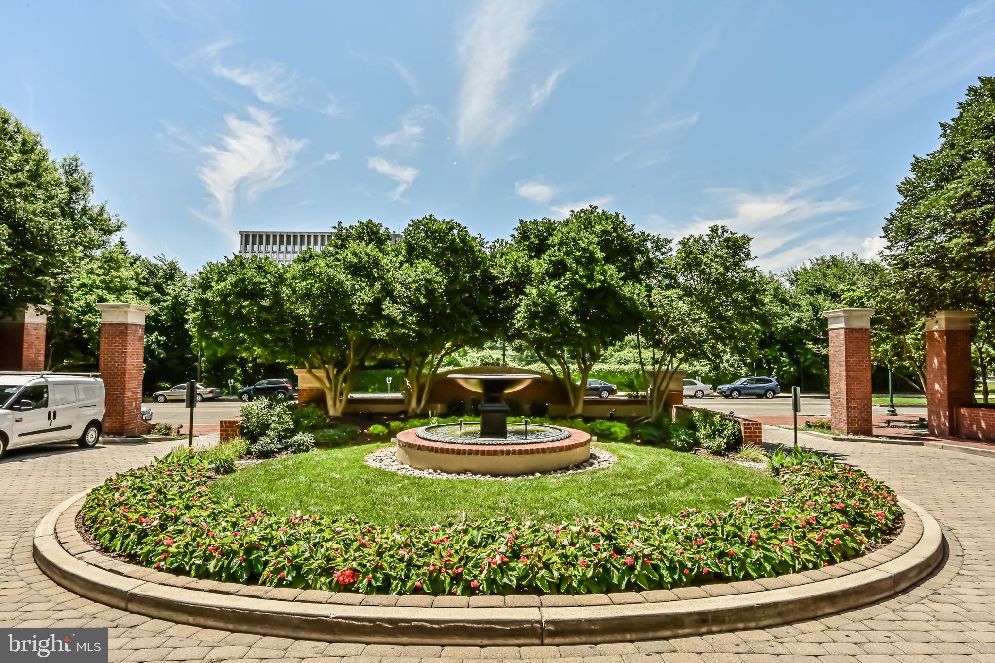 11710 Old Georgetown Road, Unit 1212 Rockville, MD 20852 - Photo 6 of 55 a view of a garden with a fountain