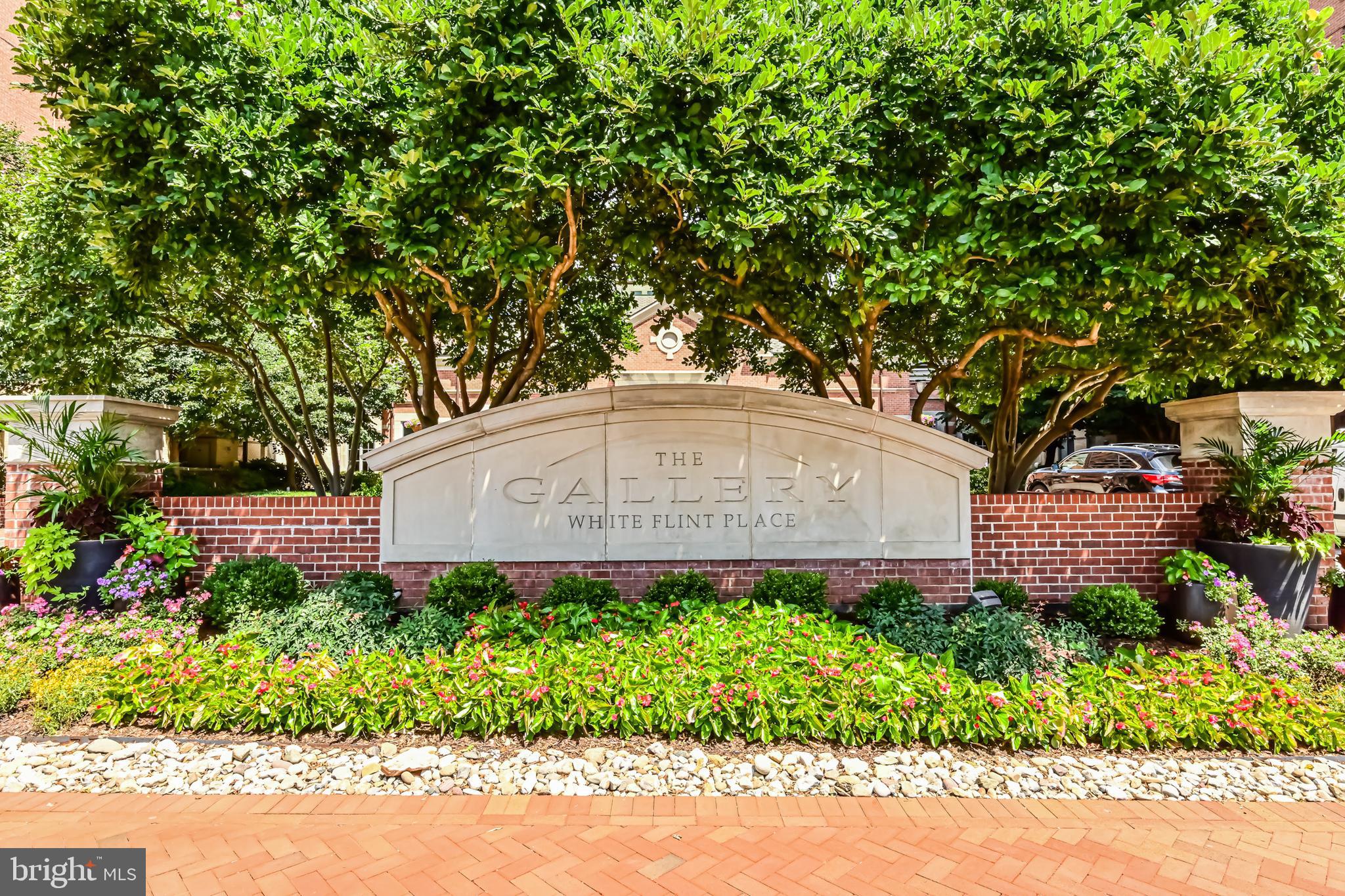 11710 Old Georgetown Road, Unit 1212 Rockville, MD 20852 - Photo 8 of 55 a garden with trees in the background
