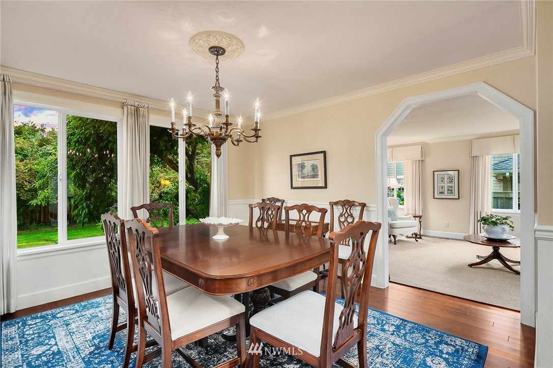 840 Bell Street Edmonds, WA 98020 - Photo 15 of 40 a dining room with furniture a chandelier and wooden floor