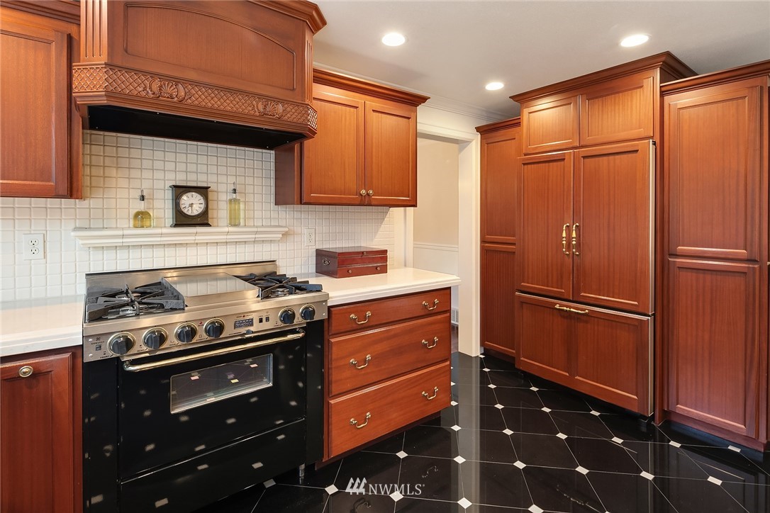 840 Bell Street Edmonds, WA 98020 - Photo 22 of 40 a kitchen with stainless steel appliances granite countertop a refrigerator and a stove