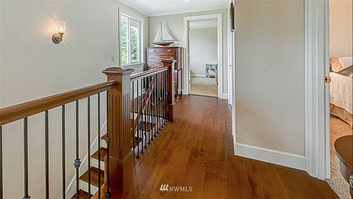 840 Bell Street Edmonds, WA 98020 - Photo 24 of 40 a view of hallway with wooden floor and stairs