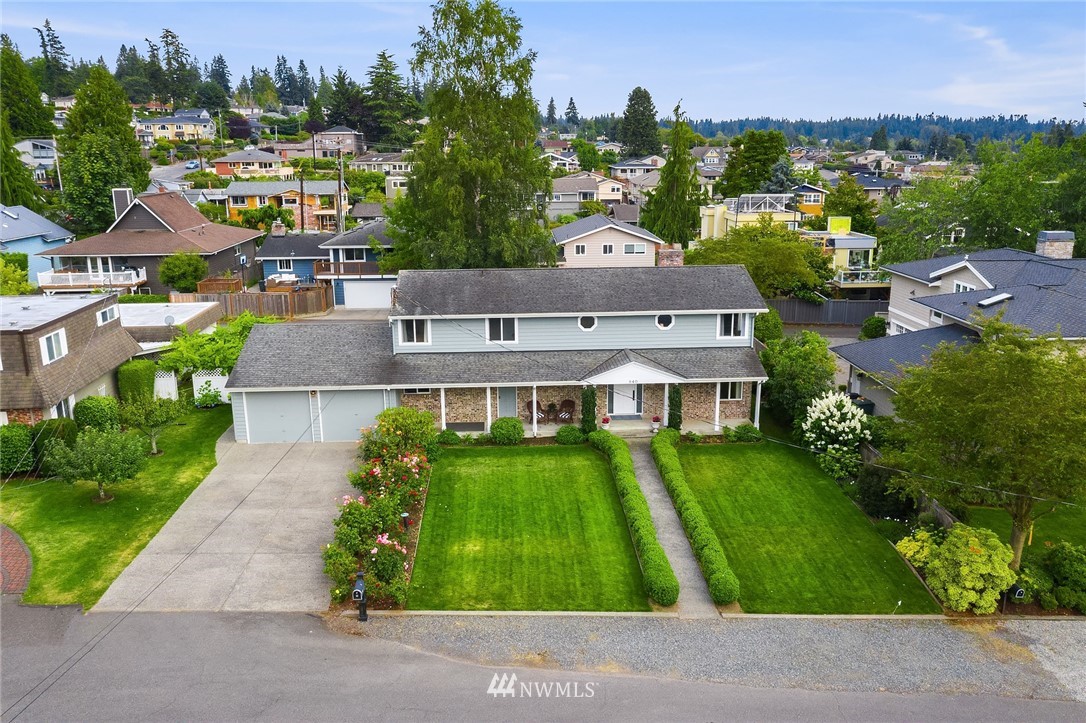 840 Bell Street Edmonds, WA 98020 - Photo 4 of 40 an aerial view of multiple houses with a yard