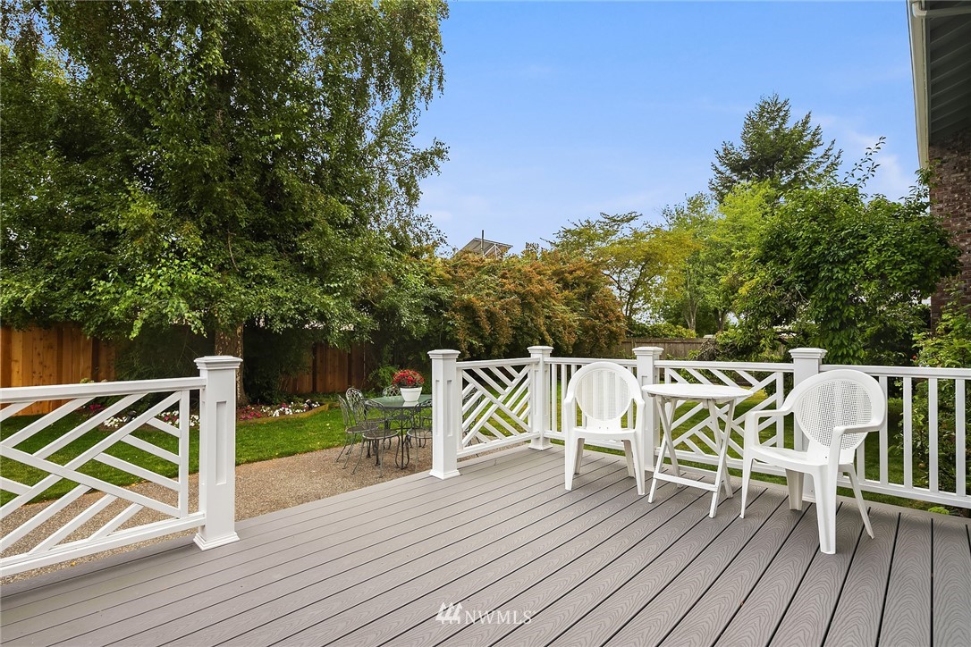 840 Bell Street Edmonds, WA 98020 - Photo 34 of 40 a view of deck with table and chairs and wooden floor
