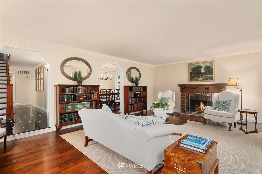 840 Bell Street Edmonds, WA 98020 - Photo 9 of 40 a living room with furniture a fireplace and a clock