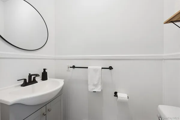 a bathroom with a sink and mirror