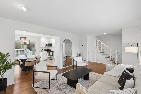 a living room with furniture or couch and a potted plant