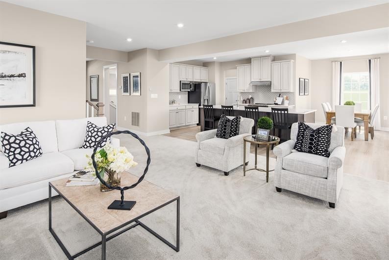 105 Ripplemead Court Gallatin, TN 37066 - Photo 9 of 21 a living room with furniture a rug kitchen view and a table