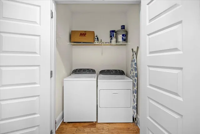 a view of storage and utility room with washer and dryer
