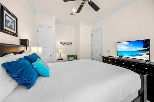 a bedroom with a bed and flat screen tv