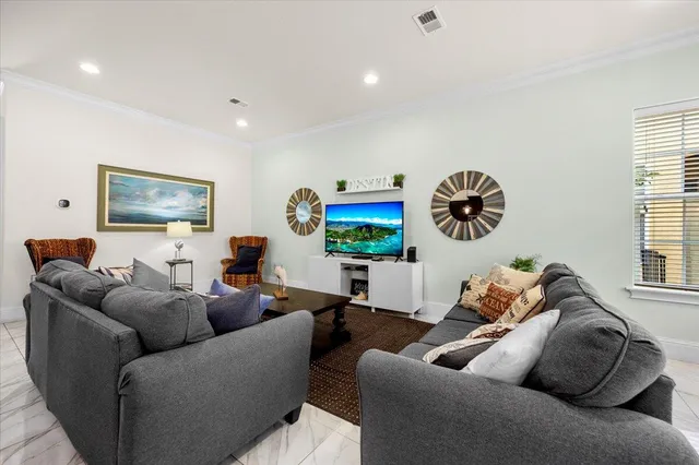 a living room with furniture and a window