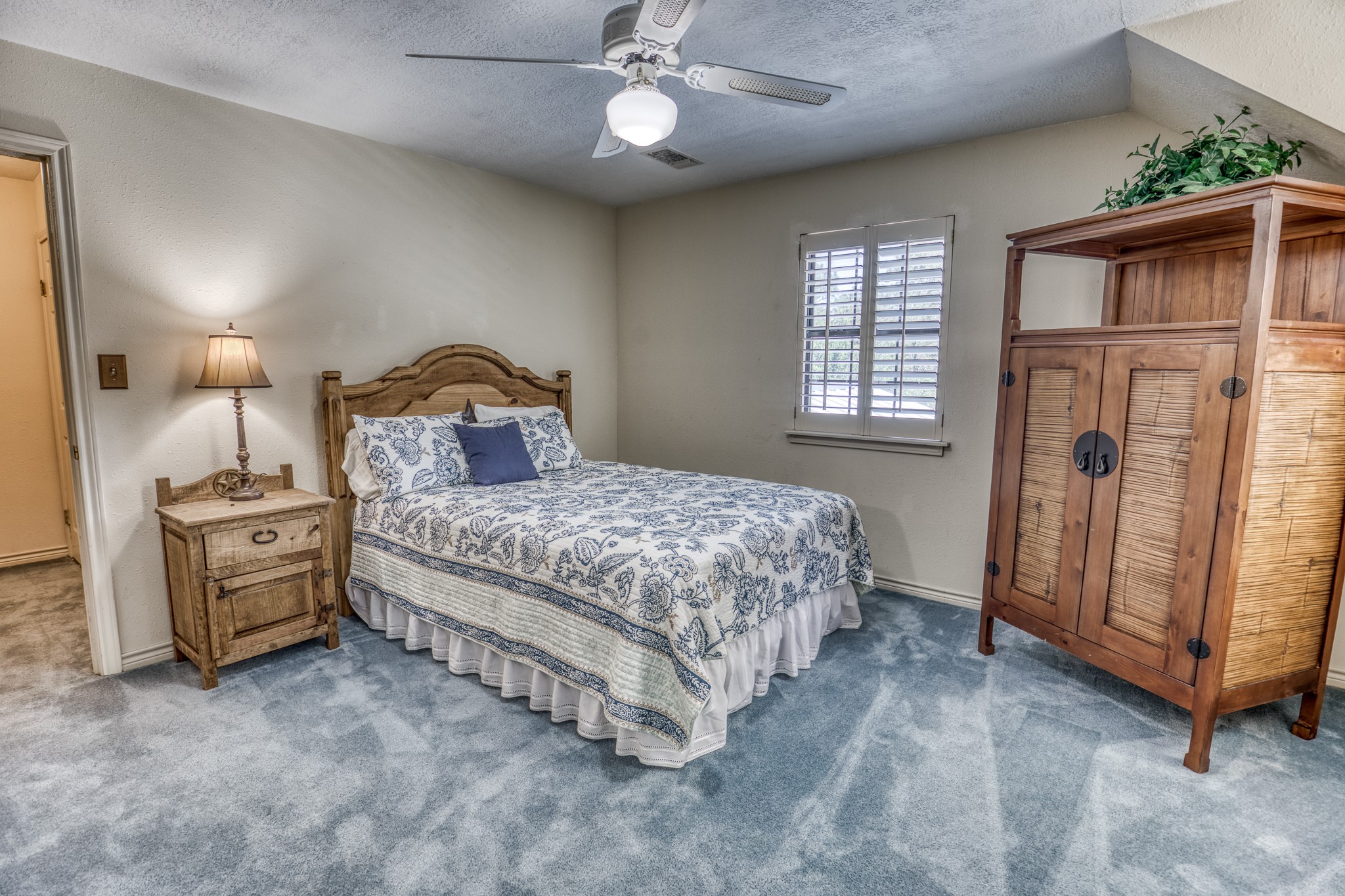 1017 Allen Road Cat Spring, TX 78933 - Photo 22 of 47 a bedroom with a bed and a refrigerator