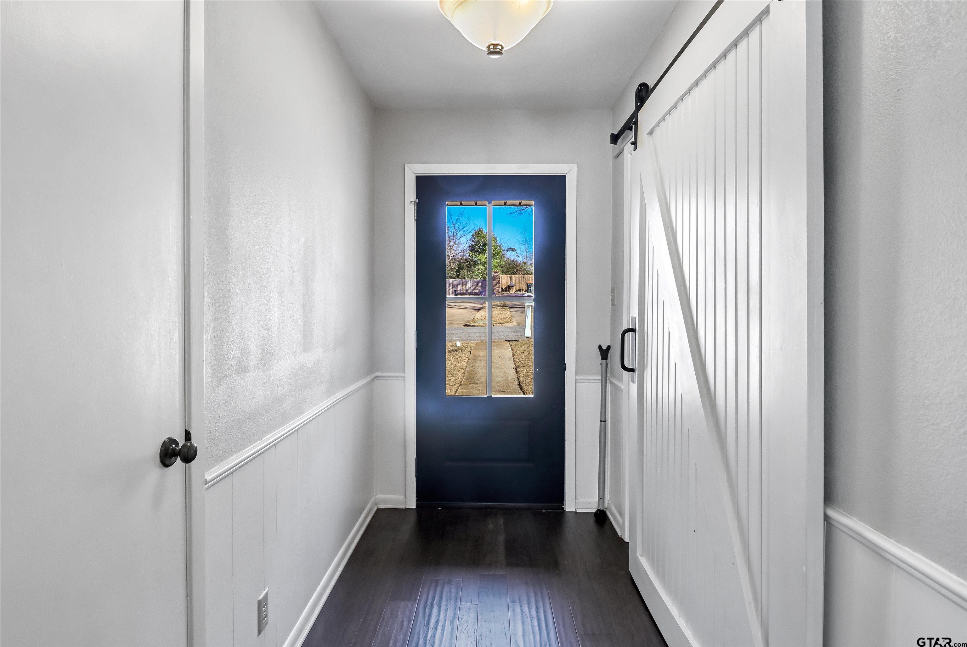 4617 Inverness Drive Tyler, TX 75703 - Photo 20 of 24 a view of a hallway view with wooden floor and staircase