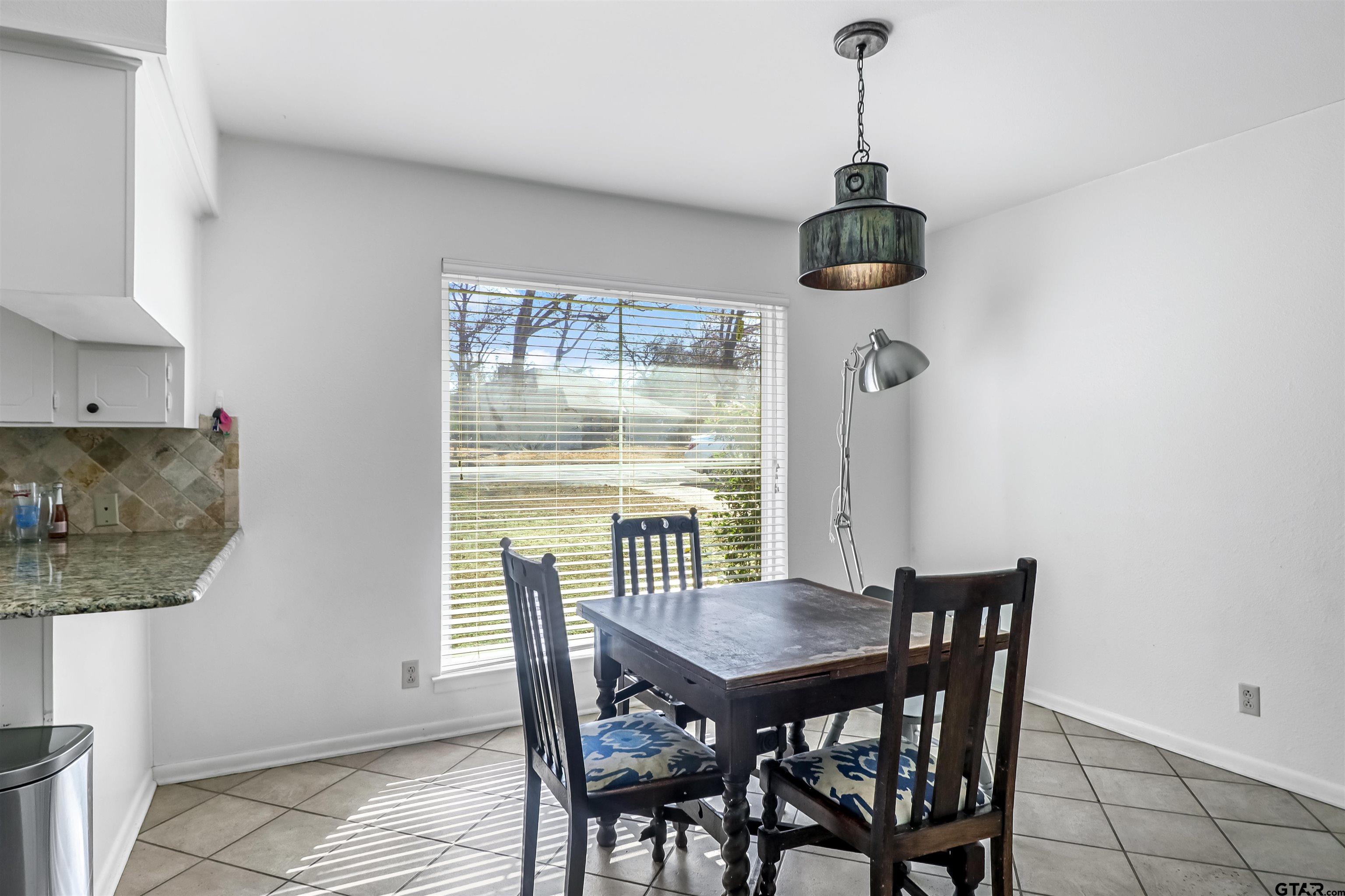 4617 Inverness Drive Tyler, TX 75703 - Photo 7 of 24 a view of a dining room with furniture window and outside view