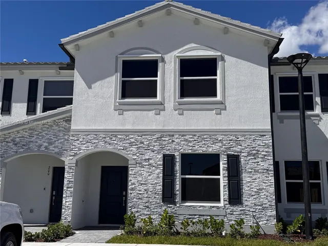 a front view of a house with yard