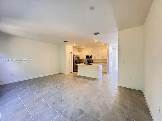 a view of a kitchen with a sink