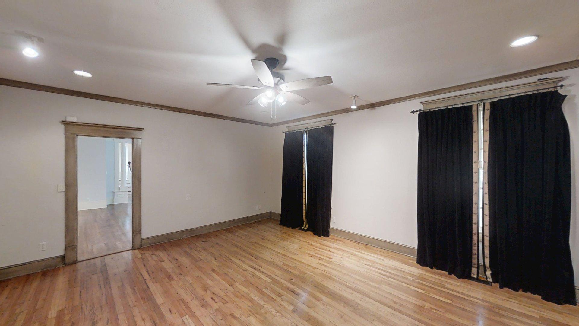 219 F Street Southwest Ardmore, OK 73401 - Photo 37 of 58 Hardwood flooring throughout, recessed lighting, and a ceiling fan with integrated lighting