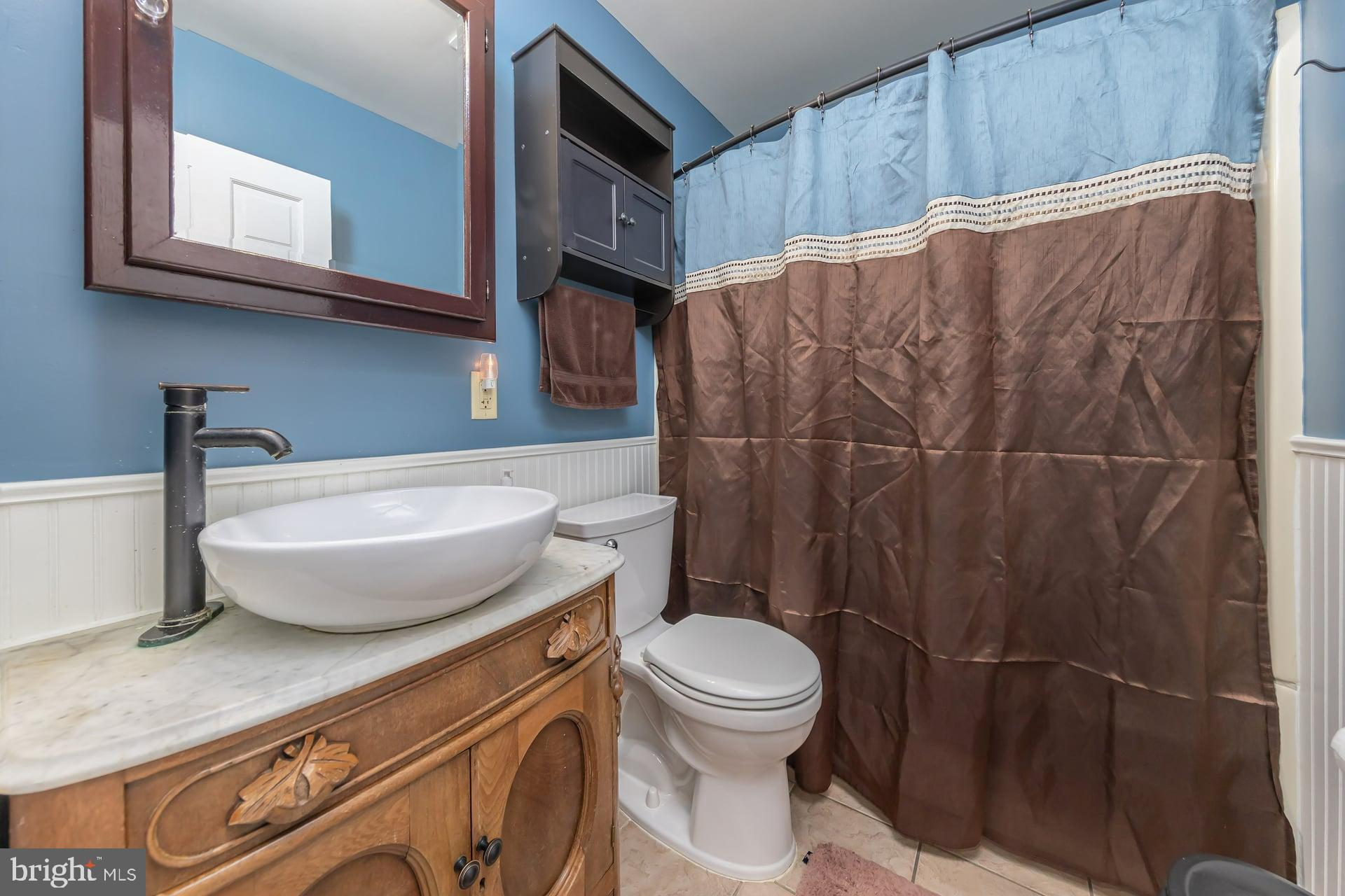 411 Ives Avenue Carneys Point, NJ 08069 - Photo 11 of 19 a bathroom with a toilet and a sink