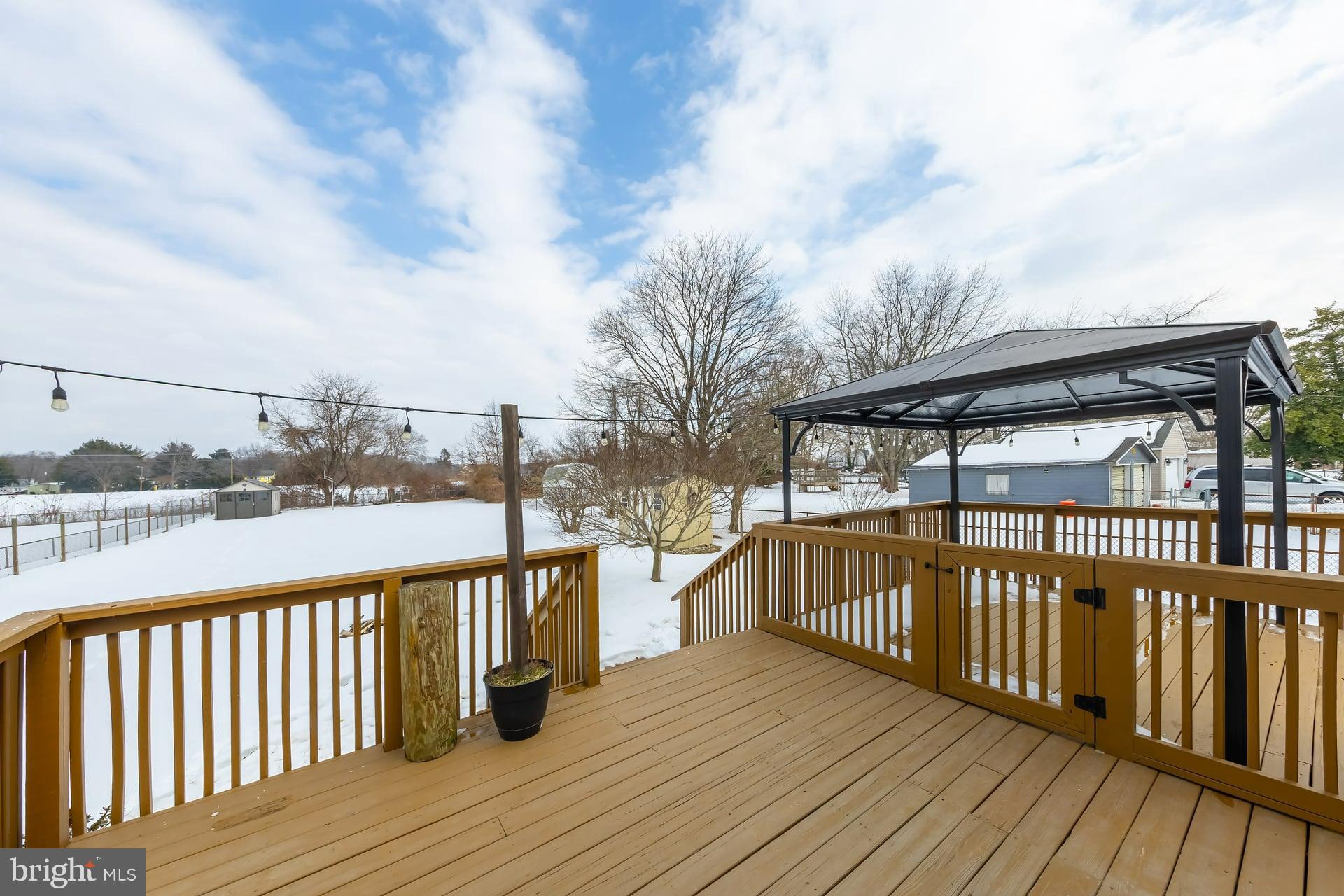 411 Ives Avenue Carneys Point, NJ 08069 - Photo 8 of 19 a view of wooden deck with a lake view