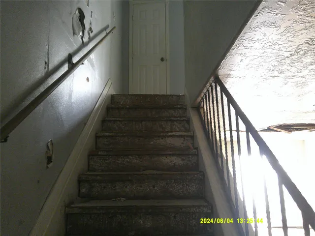 a view of an empty room and a window