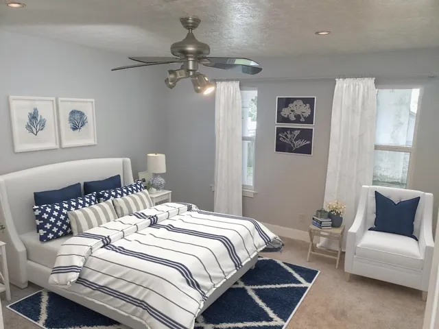 a living room with furniture and a potted plant