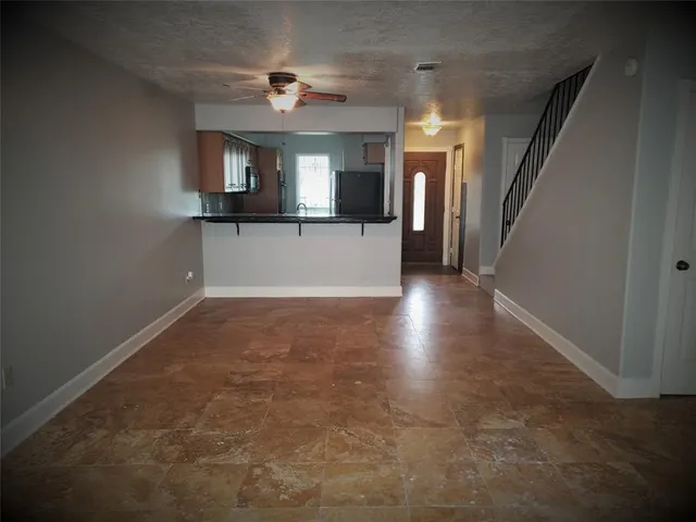 a backyard of a house with outdoor seating