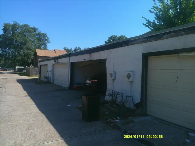 a bathroom with a granite countertop toilet and a sink