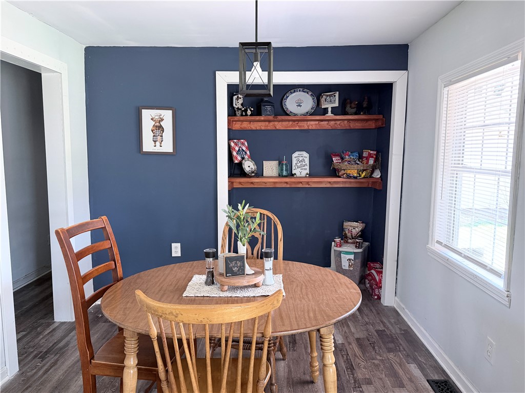 6800 Farmington Road Miamisburg, OH 45342 - Photo 11 of 32 This inviting dining area features built-in shelving, providing both style and practicality for everyday living.